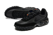 Angled view of black Nike Air Max Waffle SP sneakers with lace-up fronts and lugged outsoles.
