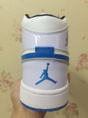 Rear view showing the blue ankle detail, padded collar, and heel branding.