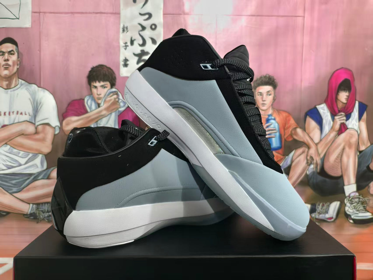 Pair of grey, white, and black Nike Kobe AD basketball shoes shown from the side.
