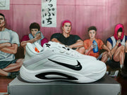 Side profile of a white Nike sneaker with black Swoosh branding and sculpted black side-panel detailing.