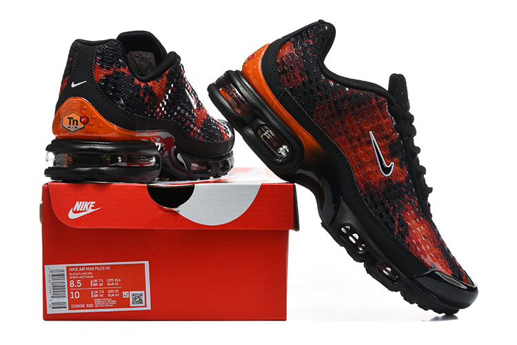 Black and red-orange Nike sneakers displayed with a red shoe box; the box label shows a sample size.