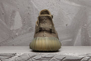 Rear view showing the heel pull tab, padded collar and translucent sole.