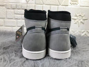 Rear view of the pair showing grey heel panels, black collars and white midsoles.