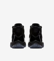 Studio rear view of a pair of black high-top sneakers.
