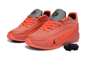 Bright red pair shown from the front three-quarter angle with gray tongues and side ventilation panels.