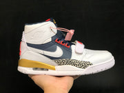 Close side view showing the high-top design, forefoot strap, elephant-print panel and visible heel Air unit.