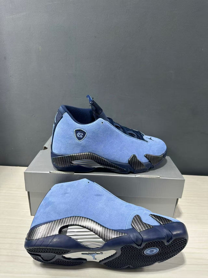 Blue and navy Jordan Air Jordan 14 sneakers shown from the side and outsole, highlighting textured panels and patterned tread.
