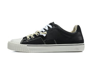 Side view of a black low-top sneaker with white stitching, toe cap, and sole.