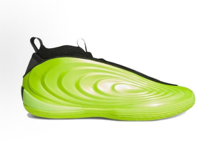 Side view of a yellow-green sculpted sneaker with black trim, a low-profile sole, and pull tabs.