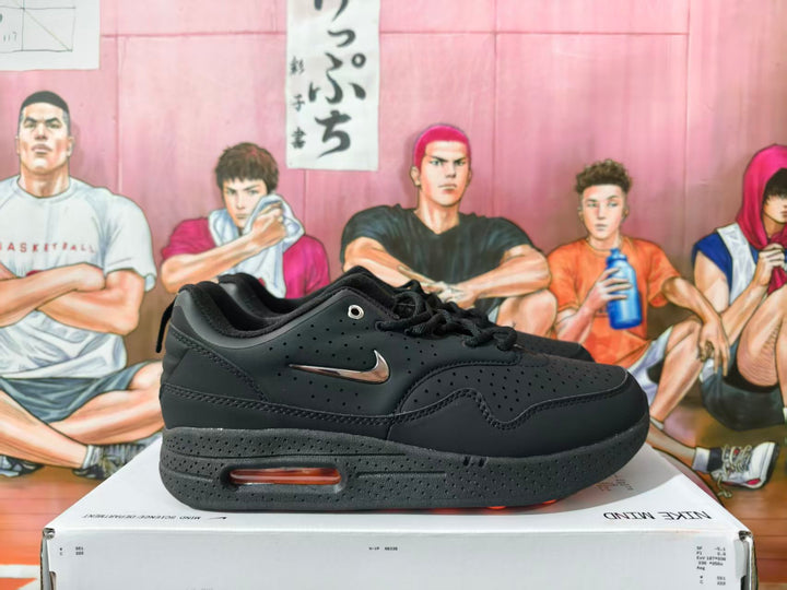 Black Nike low-top sneaker shown from the side with perforated panels, metallic-tone Swoosh, and visible sole window.