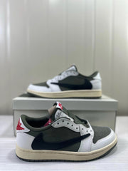 Close view of the low-top sneaker showing its side panels, heel, and cream-colored midsole.