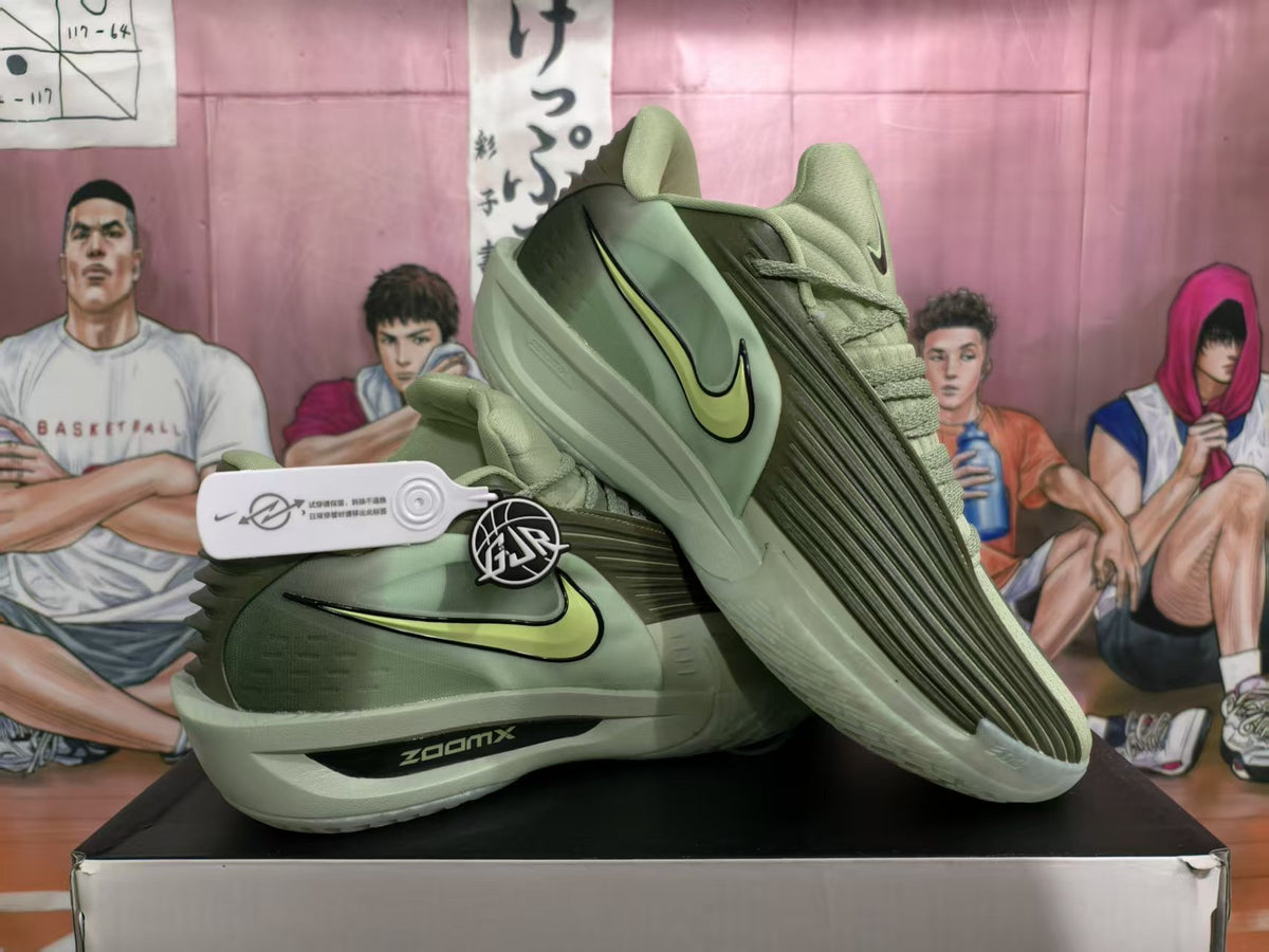 Green Nike basketball sneakers shown from a three-quarter side angle, with lime-green Swoosh details and a visible ZOOMX midsole marking.