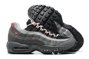 Side view of grey Nike Air Max 95 TT sneakers with black tread soles