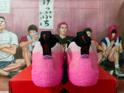 Rear view of the neon pink Nike sneakers showing black heel pull tabs, red branding details, and translucent pink soles.