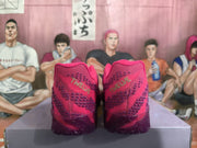 Rear view of bright pink Nike basketball sneakers with dark purple patterned heel panels and a dark translucent outsole.