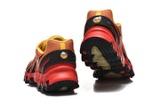 Nike Air Max DN8 sneakers viewed from the heel, showing the red and black outsole.