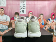Rear view showing the padded collars, translucent heel sections, and white outsole.