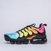 Side profile of a multicolor Nike Air VaporMax Plus sneaker
