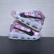 Two sneakers arranged to show the side lettering and sole shape.