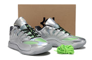 Pair of silver Nike KD 18 sneakers displayed together with green laces.