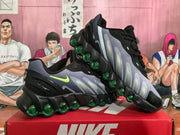 Angled view of a pair of Nike sneakers showing the layered upper, bright green Swooshes and segmented green outsole cushioning units.