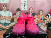Front view of the pink and purple sneakers showing the laces, patterned toe boxes, and tongue markings.