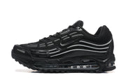 Side profile of a black lace-up sneaker with gray detailing and visible sole cushioning.