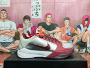 Side profile showing the silver and burgundy upper, contrasting swoosh, white midsole, and visible Zoom outsole lettering.