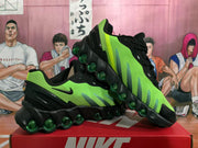 Angled view of the black and bright green Nike Air Max sneakers highlighting the layered outsole and green air units.