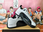 Angled view of white and black Jordan sneakers showing the side overlays and stitched panels