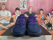 Front view of purple Nike basketball sneakers with purple laces, dark uppers, and contrasting colored details.