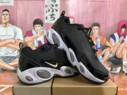 Angled view of the pair showing the black and white colorway, side Swoosh, textured upper, and oval outsole details.