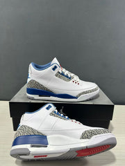 Pair of white, blue, and grey Jordan Air Jordan 3 sneakers shown from side and outsole angles on a shoebox.