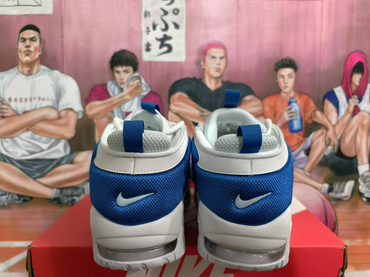 Rear view of white and blue Nike sneakers showing blue textured heel panels, white collars, heel logos, and visible sole cushioning.