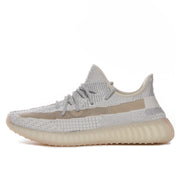 Profile view highlighting the knit-textured upper, tonal laces, side stripe, and translucent sole.