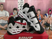 Pair of black, white, and red Nike sneakers displayed at an angle.