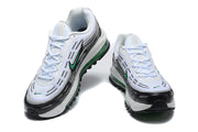 Front and top views of the white, black, and green Nike sneakers.