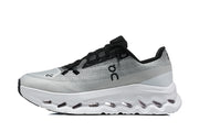 Side view of a grey On Cloudmonster 3 shoe with a white sculpted sole