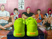 Rear view of the volt green shoes showing heel details and sculpted soles.