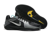 Nike Sabrina 2 shoes shown beside an outsole with textured tread and yellow accents.