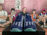 Front view of the navy Nike basketball sneakers showing the laces, perforated toe areas, tongue logos, and X-ray graphics.