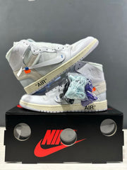 Pair of white high-top sneakers with several additional colored lace sets displayed in packaging.