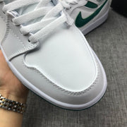 Close-up of the white toe box, white laces, and stitched panel details.