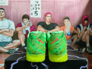 Rear view showing red lettering on the heels and the textured neon green construction.