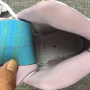 Close-up of the pink padded collar and interior lining.