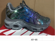 Dark grey Nike Air Max Plus sneaker photographed above a box; captioned size range 40–46
