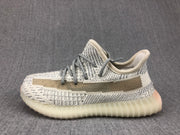 Side profile showing the contrasting side stripe and ribbed translucent sole.