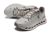 Pair of gray On Cloudmonster 3 running shoes, viewed from above