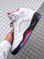 Side profile showing the white upper, perforated panel, visible air unit, black midsole, red detailing, and translucent blue outsole.