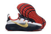 White and navy LeBron TR1 shoes showing the red and navy outsole